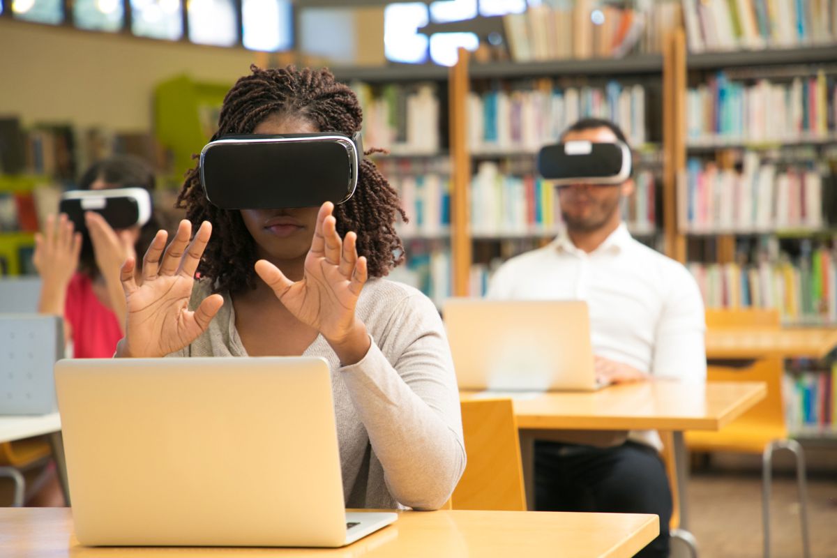 A student exploring a virtual reality lesson in a library